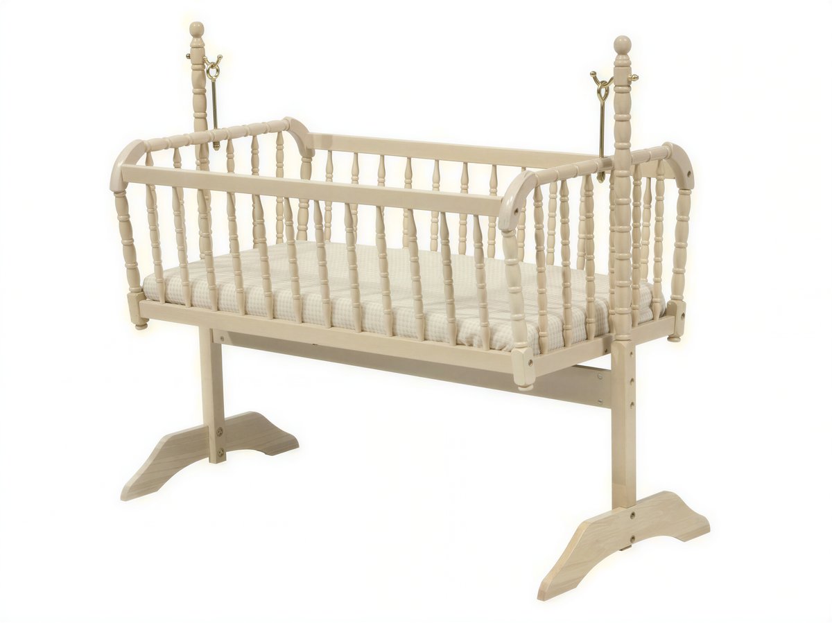 A white wooden baby crib with a simple, classic design.