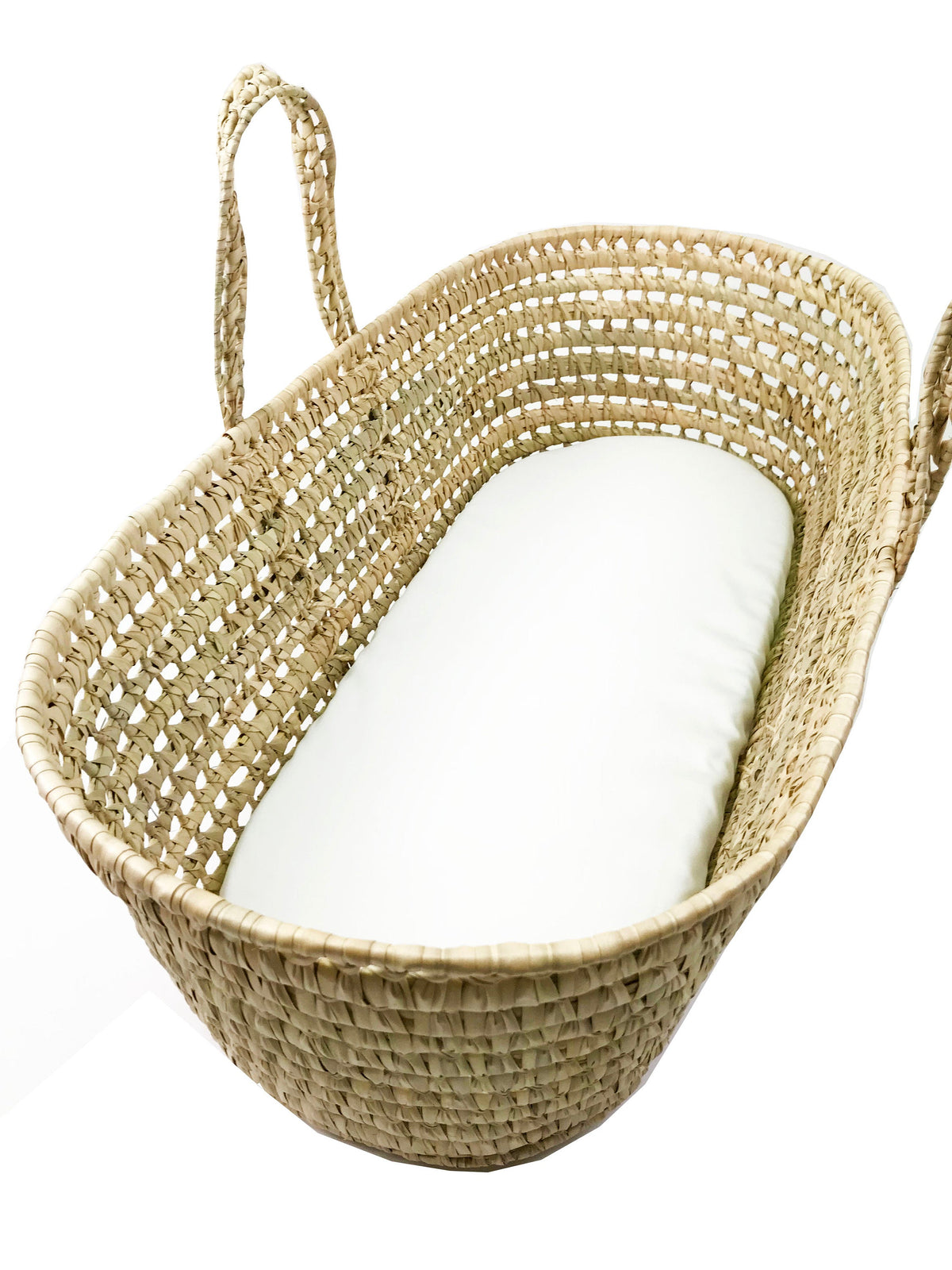 A woven basket with a white mattress inside.