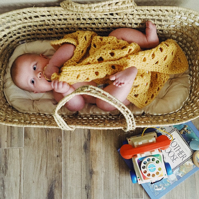 This is an organic cotton futon pad in a palm leaf Moses basket custom designed to fit. Made with 100% organic cotton stuffing and fabric. Click photo to see more