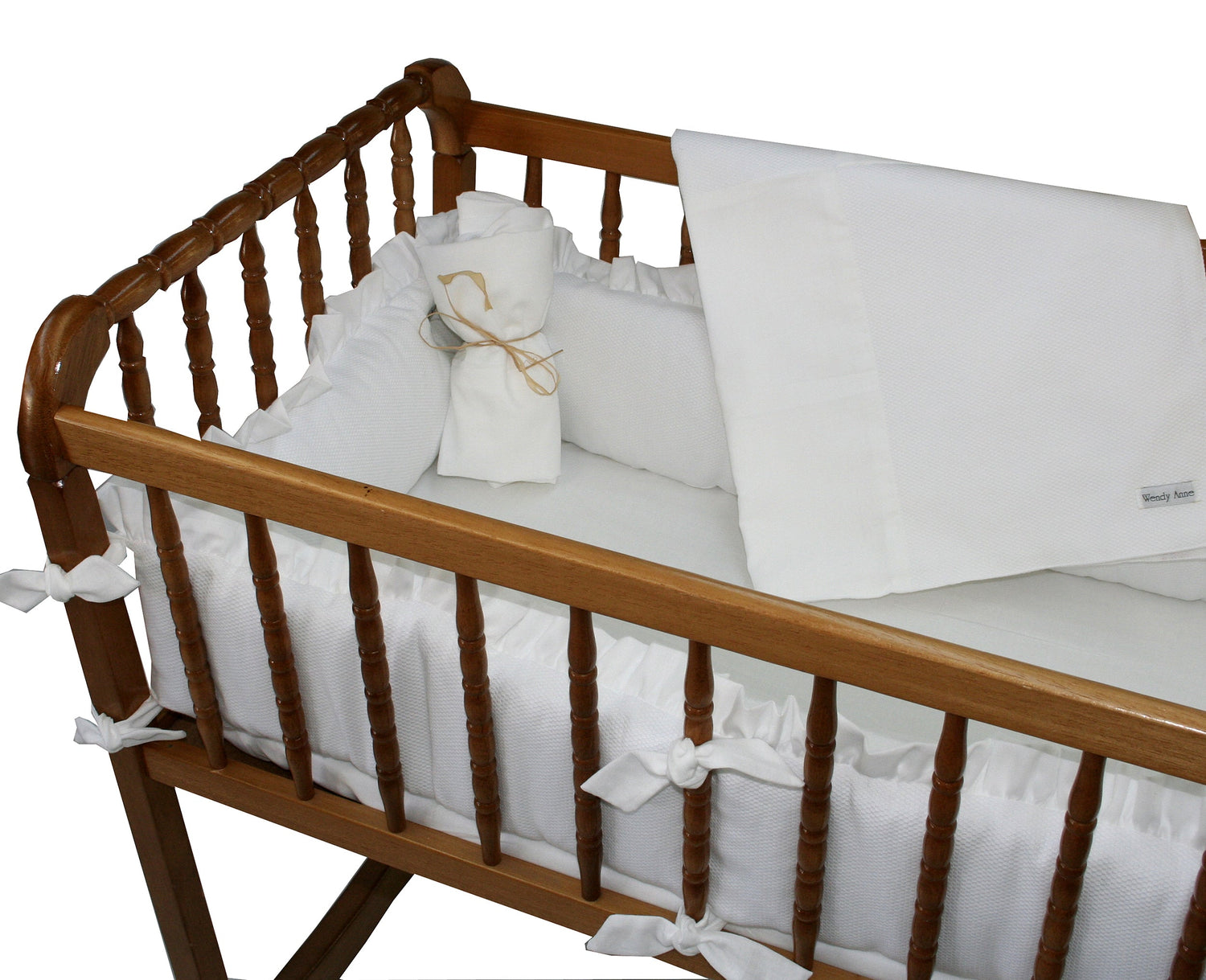 White pique with white cotton 4 piece custom designed cradle bedding set. Includes 2 fitted sheets, 1 bumper, 30 by 40 inch receiving blanket. Choose from white, pink or blue