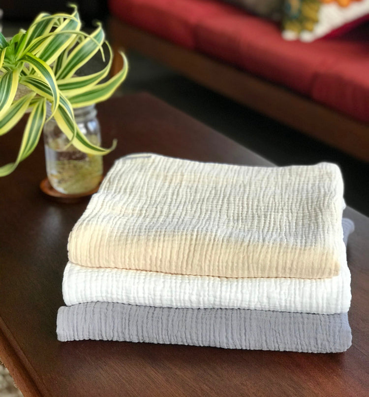 Wendy Anne organic cotton double gauze swaddle blanket in 3 colors, ivory, off white and gray. Blanket is 46 by 46 inches for swaddling newborn babies. Click images to see the whole collection