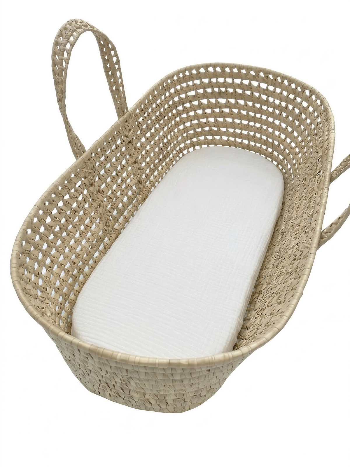 A woven basket with a white mattress inside.