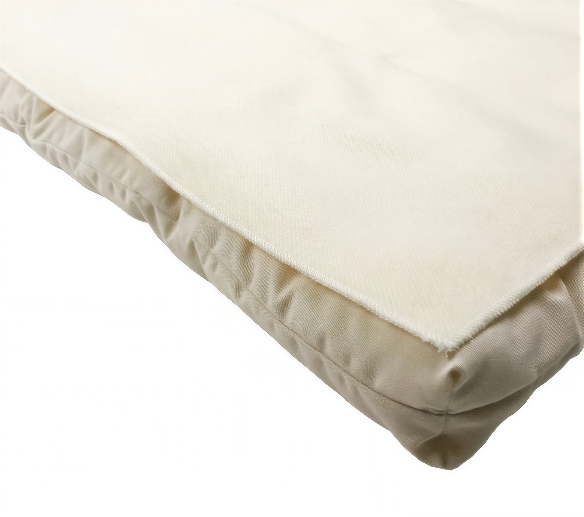 A close-up view of a beige, soft-looking fabric or cushion, possibly a throw pillow or cushion cover.